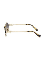 Miu Miu lunettes de soleil ovales à plaque logo
