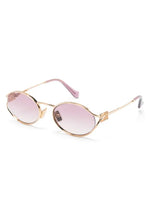 Miu Miu lunettes de soleil ovales à plaque logo